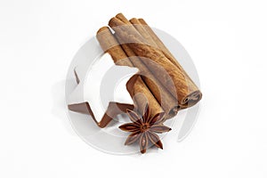 Christmas decoration cinnamon sticks star anise and cinnamon star on white background