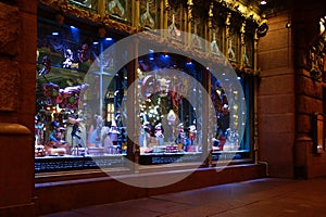 Christmas decoration of the city with electric glowing lights, a showcase for the Eliseevsky shop on Nevsky Prospect i