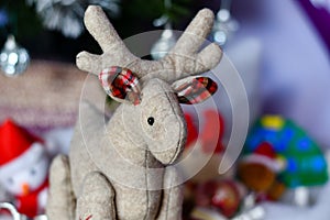 Christmas decoration with close up of Christmas deer and cones with snow