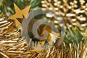 Christmas decoration detail with golden strars and garland