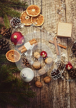 Christmas Decoration. Dried Oranges, Cinnamon Sticks, Walnuts, Baubles, Pine Cones.