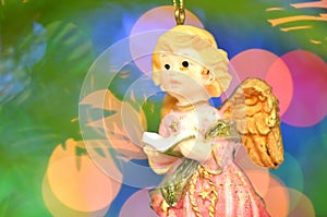 Christmas decoration, figure of little angel singing carols