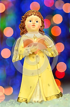 Christmas decoration, figure of little angel singing carols