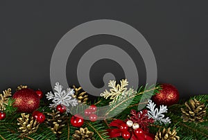 Christmas decoration with fir branches on a dark background
