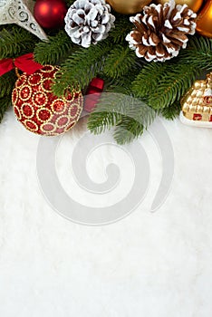 Christmas decoration on fir tree branch closeup, gifts, xmas ball, cone and other object on white blank space fur, holiday concept