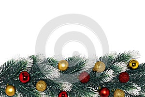 Christmas decoration fir tree branches with snow, gold red balls on white background