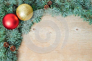 Christmas decoration fir tree and ornaments on wooden background