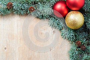 Christmas decoration fir tree and ornaments on wooden background