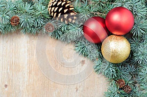 Christmas decoration fir tree and ornaments on wooden background