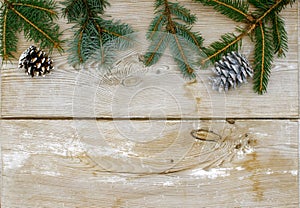 Christmas decoration, fir twigs, spruce and pine cones on a rustic wooden background, space for text, background, wallpaper