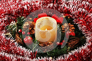 Christmas decoration in the form of a candle and a wreath