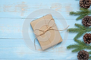 Christmas decoration, gift box and pine tree branches on wooden background, preparation for holiday concept, Happy New Year and Xm