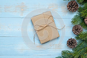 Christmas decoration, gift box and pine tree branches on wooden background, preparation for holiday concept, Happy New Year and Xm