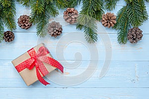 Christmas decoration, gift box and pine tree branches on wooden background, preparation for holiday concept, Happy New Year and Xm