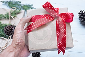 Christmas decoration, gift box and pine tree branches on wooden background, preparation for holiday concept, Happy New Year and Xm