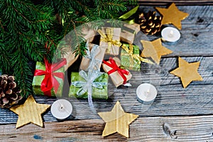 Christmas decoration with gifts and present boxes under a pine tree.Golden harmony.
