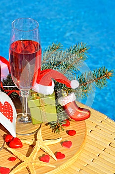 Christmas decoration and Glasses with red champagne.