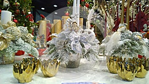 Christmas decoration: gold candlesticks and shiny silver decor. Traditional Xmas ornaments. Happy New Year. Winter accessories for