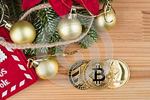Christmas decoration - golden baubles, poinsettia, fir branches with Bitcoin
