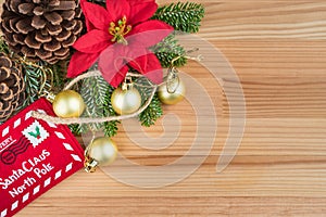 Christmas decoration - golden baubles, poinsettia, fir branches and cones