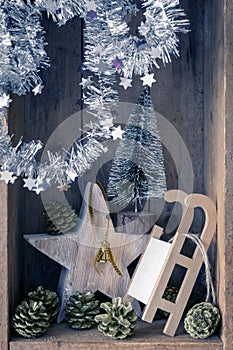 Christmas decoration golden bell jar, sledge, star and tree in a