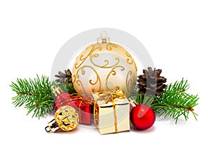 Christmas decoration golden and red balls with fir cones and fir tree branches isolated on a white background