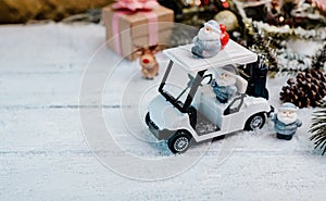 Christmas decoration with golf car and gift for winter season on December
