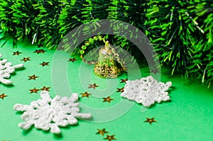 Christmas decoration on the green background. Ornaments, snowflakes, stars. Christmas tree