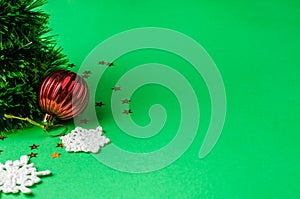 Christmas decoration on the green background. Ornaments, snowflakes, stars. Christmas tree