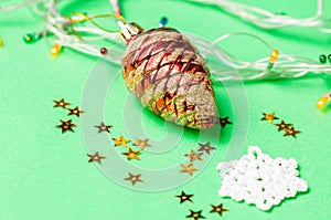 Christmas decoration on the green background. Ornaments, snowflakes, stars. Copy space