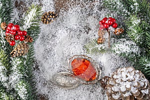 Christmas Decoration greeting card- Red caviar in silver bowl, Snowy Pine Cones On Fir Branch With Christmas Lights