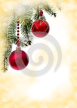 Christmas decoration. Hanging red balls on abstract golden background with space for text