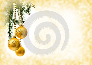 Christmas decoration. Hanging yellow balls on abstract golden background with space for text