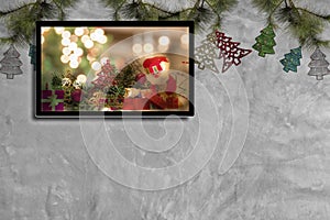 Christmas decoration with hdtv on concrete wall background