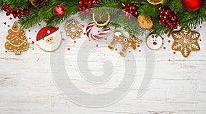 Christmas decoration with holiday tree branches, ball toys, gingerbread cookies