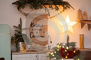 Christmas decoration and inscription on the kitchen wall