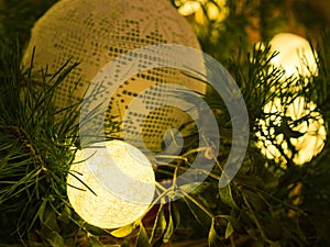 Christmas decoration. Lighting balls, pine and mistletoe.