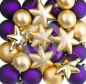 Christmas decoration. Lila and golden baubles, balls, stars photo