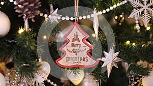Christmas decoration with Merry Christmas text hanging on the tree