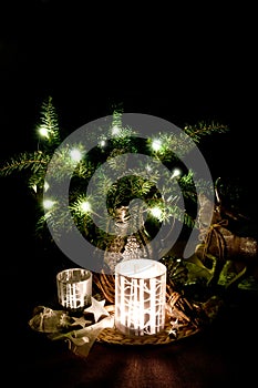 Christmas decoration with pine branches, reindeer and candleligh