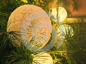 Christmas decoration. Pine and mistletoe branches. Hand made white bauble.