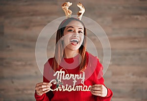 Christmas, decoration and portrait of woman with motivation holding xmas sign. Wow, excited and isolated happy female