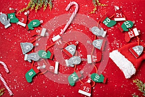 Christmas decoration on red background, advent calendar and Sant,s hat