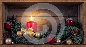 Christmas decoration red candle in a wooden box background