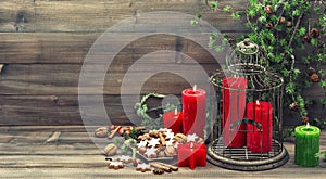 Christmas decoration with red candles and cinnamon cookies