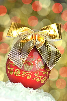 Christmas decoration, red Christmas ball with golden bow