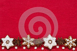 Christmas decoration on a red fabric background. Christmas cookies in the shape of snowflakes handmade