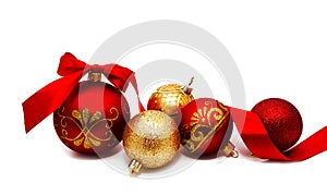 Christmas decoration red and gold yellow balls with ribbon isolated on a white