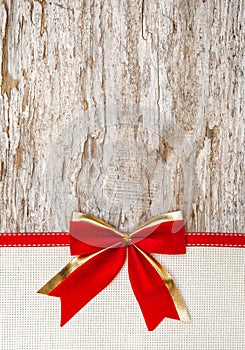 Christmas decoration with red ribbon, bow and canvas