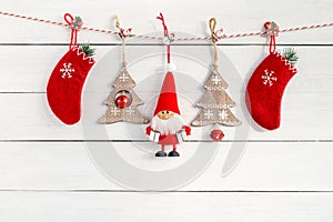 Christmas decoration with Santa and Christmas socks on white woo